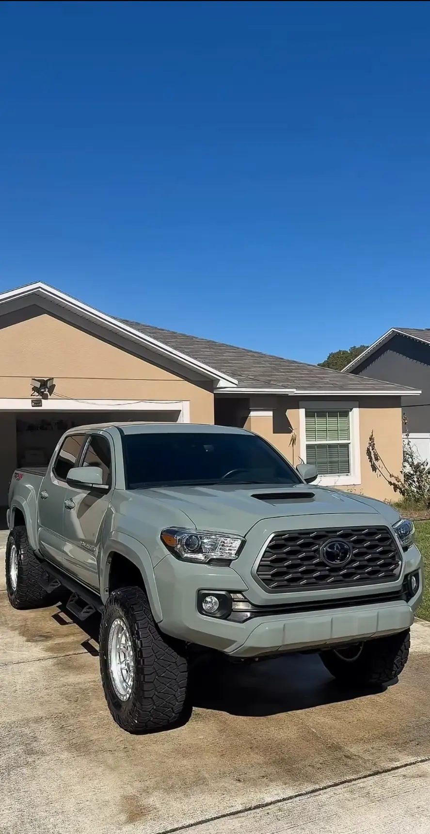 Green Toyota Tacoma detailed at the customer's home